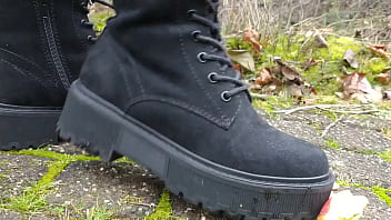 Woman crush apple underfeet