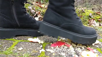 Woman crush apple underfeet