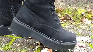 Woman crush apple underfeet