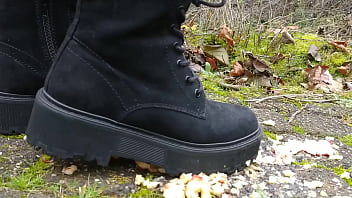 Woman crush apple underfeet