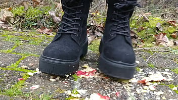 Woman crush apple underfeet