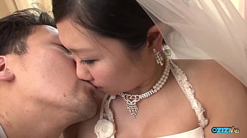 The New Asian Bride Remains Attired In Her Bridal Gown Throughout A Visitor's Arrival thumbnail