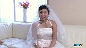 The new asian bride remains attired in her bridal gown throughout a visitor's arrival