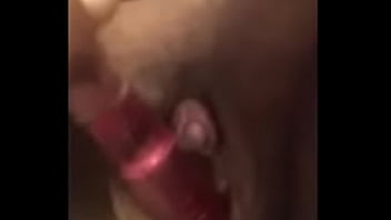 Black girl playing with her pussy with a toy