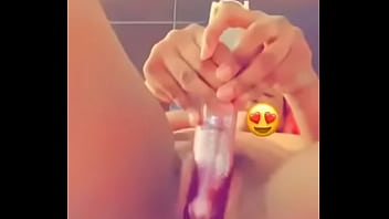 Fucking herself with a toy