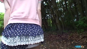 A youthful asian individual engages in manual stimulation inside a vehicle and performs oral sex on an erect penis