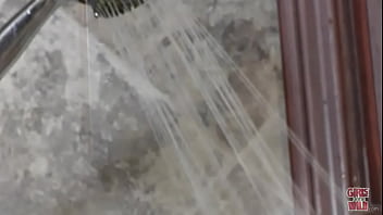 Shy redhead and a shower head