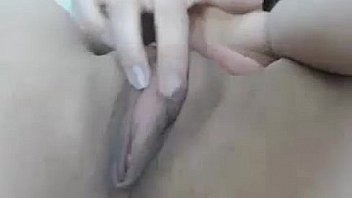 She plays with a dildo in her tight pussy