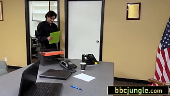 Busty redhead boss takes a thick black cock on her desk