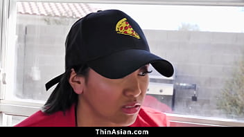 Boys helping themselves to a little bit more than the pizza thinasian Boys helping themselves to a little bit more than the pizza thinasian