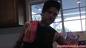 Goth models stripping during a photo session