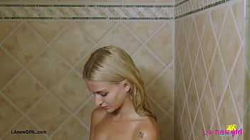 Blonde babe with a killer smile enjoyed a sensual bath