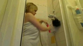 Natural busty blonde takes a shower