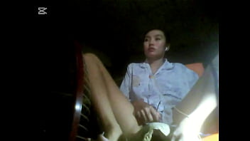 The camera under the table captured a beautiful woman at home alone and watching a porn movie