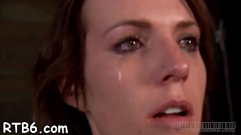 Girl is stripping inside cage