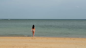 Slender beauty walks along the beach and swims in the sea meet me