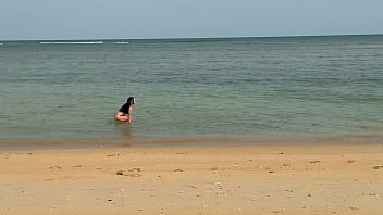 Slender beauty walks along the beach and swims in the sea meet me