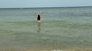 Slender beauty walks along the beach and swims in the sea meet me