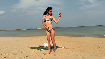 Slender beauty walks along the beach and swims in the sea meet me