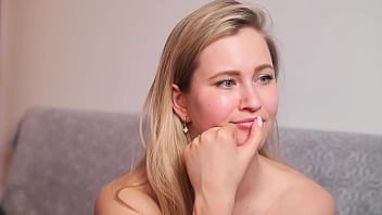 She jumps on the dildo and moans loudly watching on the big screen