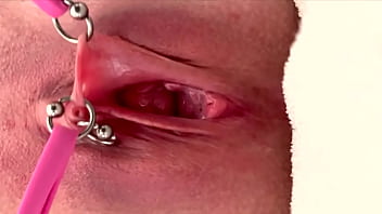 Pulling and stretching my pierced clit and pushing my pussy to pee