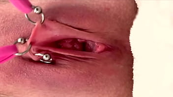 Pulling and stretching my pierced clit and pushing my pussy to pee