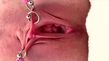 Pulling and stretching my pierced clit and pushing my pussy to pee