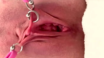 Pulling and stretching my pierced clit and pushing my pussy to pee