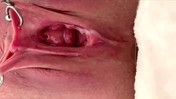 Pulling and stretching my pierced clit and pushing my pussy to pee