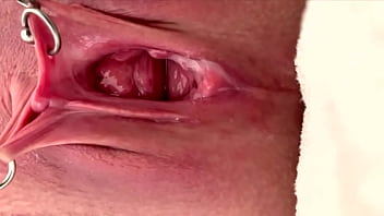 Pulling and stretching my pierced clit and pushing my pussy to pee