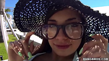 Cute girl in glasses by the pool picked up