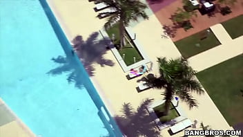Cute girl in glasses by the pool picked up