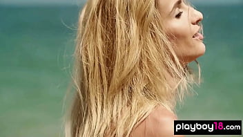 Glamorous all natural blonde muse poses naked at the beach