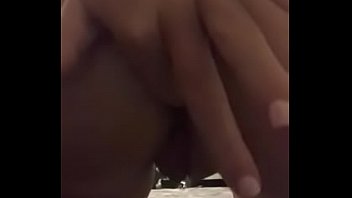 Brunette plays with ass