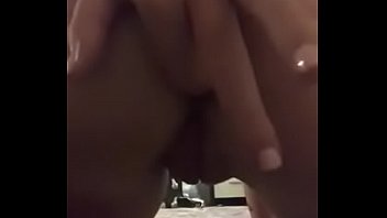 Brunette plays with ass