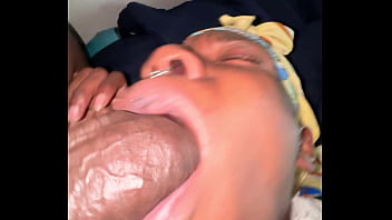 Ebony sucking a huge black cock