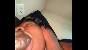 Ebony sucking a huge black cock