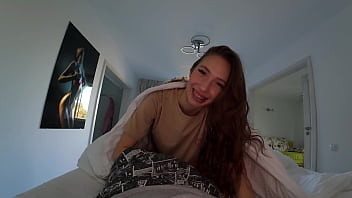 Morning surprise waking him up with kisses under the sheets