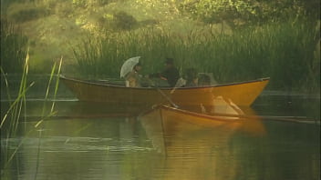 An elegant dame's pussy is squirting while is fucked in the canoe and a few minutes later her partner unloads all over her nylon clad feet
