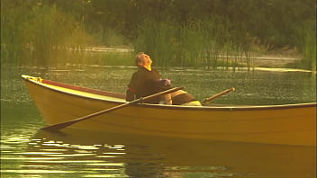 An elegant dame's pussy is squirting while is fucked in the canoe and a few minutes later her partner unloads all over her nylon clad feet