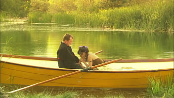 An elegant dame's pussy is squirting while is fucked in the canoe and a few minutes later her partner unloads all over her nylon clad feet