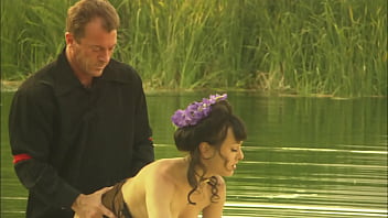 An elegant dame's pussy is squirting while is fucked in the canoe and a few minutes later her partner unloads all over her nylon clad feet