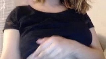 Camgirl showing her big tits while she smile