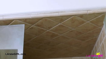 Fresh faced brunette model enjoys a sensual bath