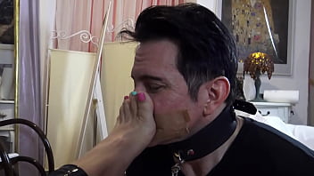 She orders him to loudly inhale the smell of her sweaty stinky feet and verbally humiliates him