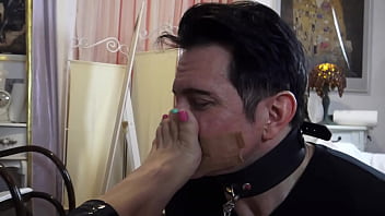 She orders him to loudly inhale the smell of her sweaty stinky feet and verbally humiliates him