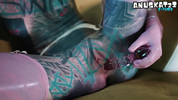 Sexy tatted latex girl stuffing herself deep from both ends with her toys