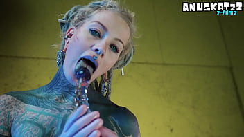 Sexy tatted latex girl stuffing herself deep from both ends with her toys