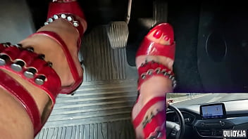 Red high heels driving