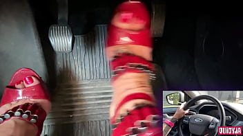 Red high heels driving